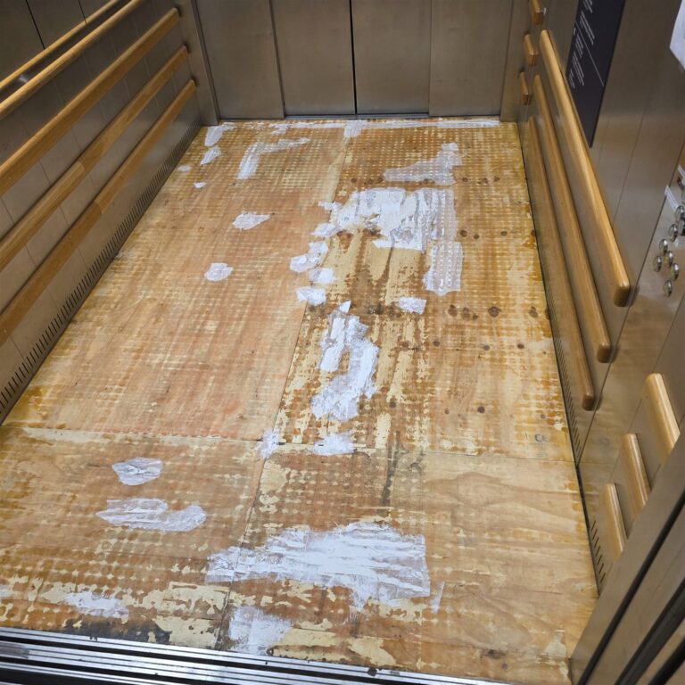 Worn elevator floor before renewal